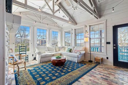 a living room with a couch and a table at Gilead Grand Lake Family Retreat in Grove
