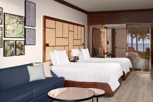 Postel nebo postele na pokoji v ubytování Le Meridien Ile Maurice