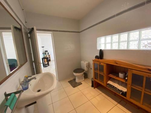 a bathroom with a sink and a toilet at Le Petit Yucca in Tiznit