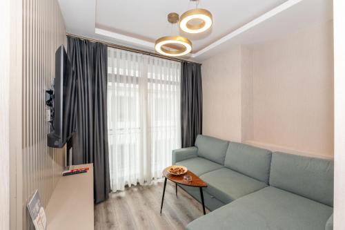 a living room with a couch and a table at Massimo Hotel in Istanbul