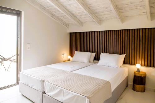 Postel nebo postele na pokoji v ubytování Sole al Mare Villa