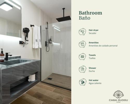 a bathroom with a shower and a sink and a mirror at Casa Guogu by AmazINN Places 3f in Panama City
