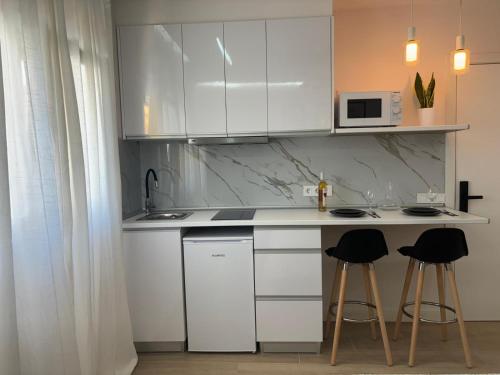 Η κουζίνα ή μικρή κουζίνα στο Alojamiento MEL BEACH