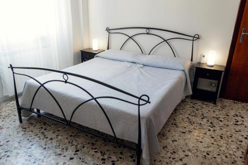 Ένα ή περισσότερα κρεβάτια σε δωμάτιο στο Lerici D'amare a 3 min a piedi dalla spiaggia