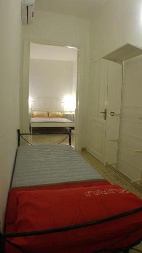 a bedroom with a bed in a room at Appartamenti al Porto in Trapani