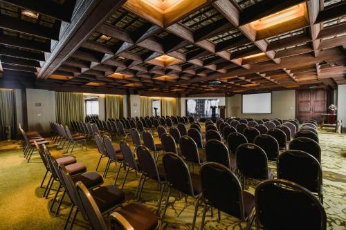 a large room with chairs and a podium in it at Palacio del Inka, a Luxury Collection Hotel, Cusco in Cusco