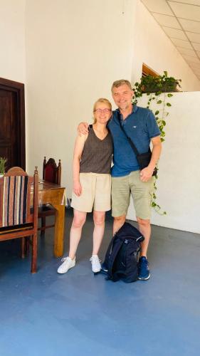 a man and a woman posing for a picture at Millenium Lodge - Anuradhapura in Anuradhapura