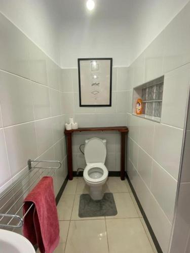 a small bathroom with a toilet and a sink at le petit yucca - chambre groovy in Tiznit