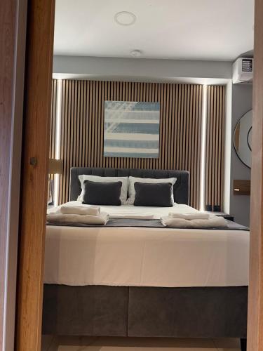 Ένα ή περισσότερα κρεβάτια σε δωμάτιο στο Afoi Hasalla Apartments 2