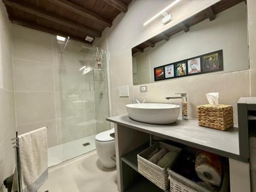 a bathroom with a sink and a shower at Casa del Lago in Monterosi