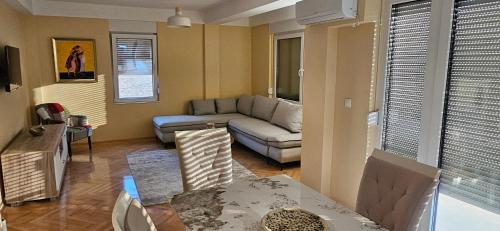 a living room with a couch and a table at ATLANTIC Apartments in Štip