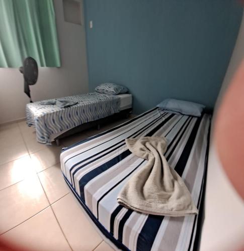 Ένα ή περισσότερα κρεβάτια σε δωμάτιο στο Meu conforto