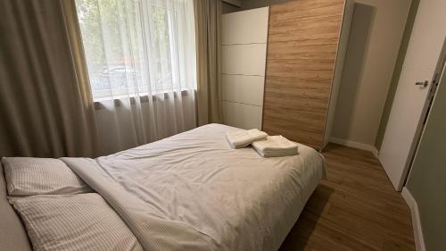 Postel nebo postele na pokoji v ubytování Apartaments Rocha 159 - Blisko Jasnej Góry