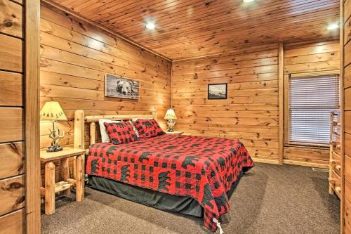 a bedroom with a bed in a log cabin at Simply Serene in the Smokies in Gatlinburg