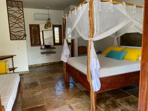 a bedroom with a bed with a canopy at casanossa prea in Prea