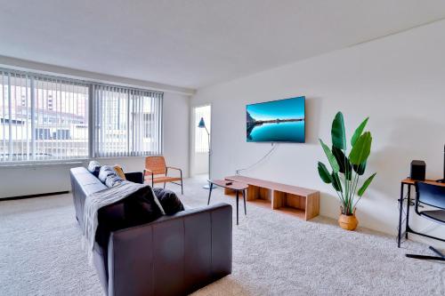 a living room with a couch and a table at Stylish Apartment Close to National Landing in Arlington