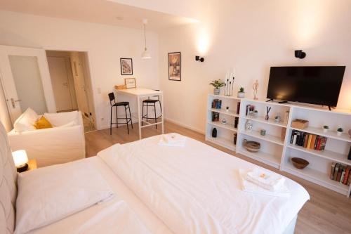 Ένα ή περισσότερα κρεβάτια σε δωμάτιο στο Charmantes City Apartment mit Domblick & Stellplatz