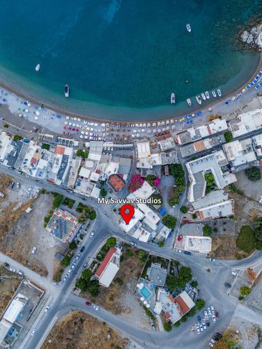 an overhead view of a city next to the ocean at My Savvas Studios in Haraki