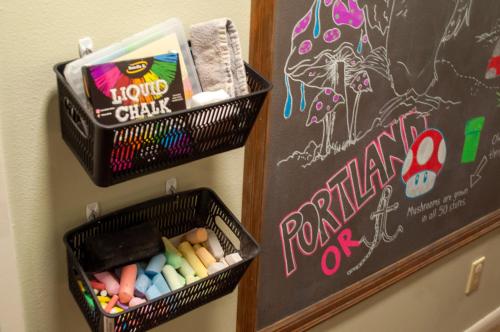 two baskets of chalk on a wall next to a chalkboard at The Owls Nest with Hot Tub and Forest Views! in Portland