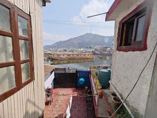 a view of a river from a balcony of a building at Lake Boulevard Guest House in Srinagar