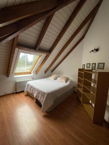 a bedroom with a bed and a large window at Alojamiento centro Bariloche in San Carlos de Bariloche