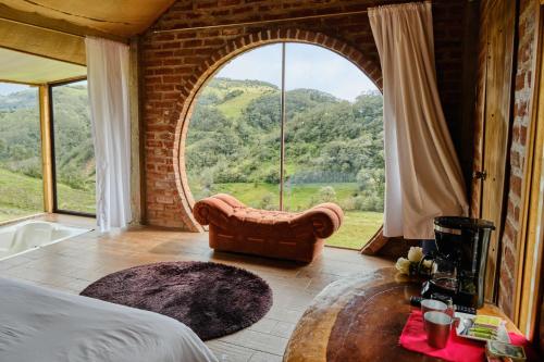 Ένα ή περισσότερα κρεβάτια σε δωμάτιο στο Rancho La Suiza