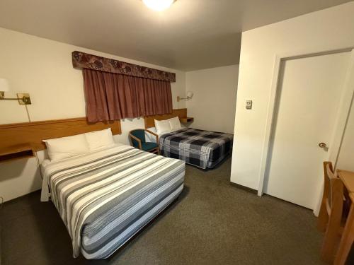 Ένα ή περισσότερα κρεβάτια σε δωμάτιο στο Lake-Vu Motel