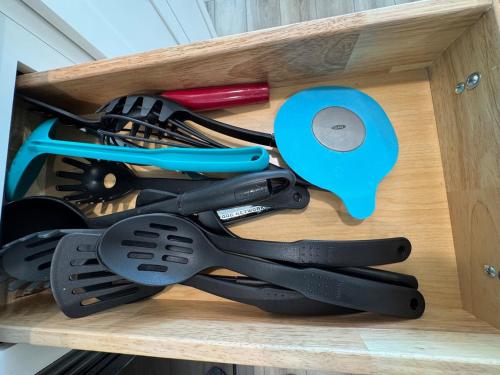 a wooden drawer with cooking utensils in it at Modern 3BR, 2BAHome Near Georgetown Square Sleeps 6 in Georgetown