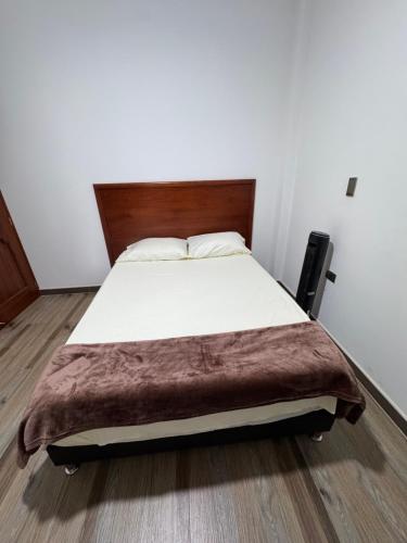 Una cama o camas en una habitación de Hotel Beronica Florian Santander