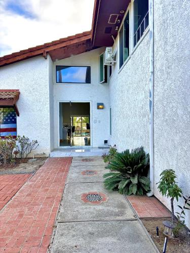 a building with a brick walkway in front of it at Vintoca Luxury Honeymoon Suite Farm Retreat in Oceanside