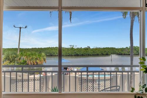 a view of a river from a window at Watch the dolphins Large balcony Suite and heated pool in Ruskin