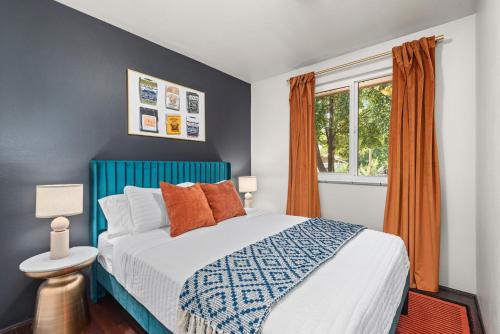 a bedroom with a bed and a window at Coffee Themed - Cozy Family Getaway - Sleeps 12 - Mini Golf BBQ Yard in Westminster
