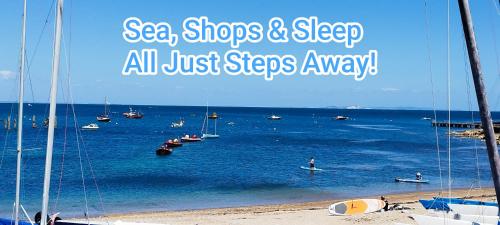 a view of a beach with boats in the water at Blue Palms in Bournemouth