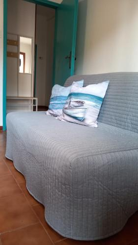 Ένα ή περισσότερα κρεβάτια σε δωμάτιο στο Turchese Apartment