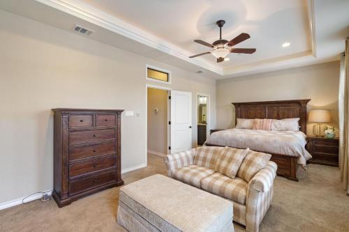 a bedroom with a bed and a couch at Bend in the River in Georgetown