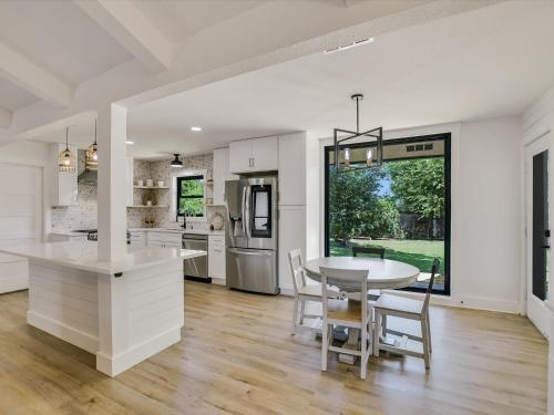 a kitchen and dining room with a table and chairs at Cherilliam Estate in Round Rock