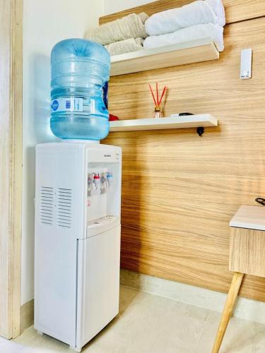 a refrigerator with a water container on top of it at Aves de Laguna Beach 