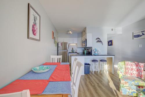a kitchen and living room with a table and a dining room at Topsail Dunes 1212 in North Topsail Beach