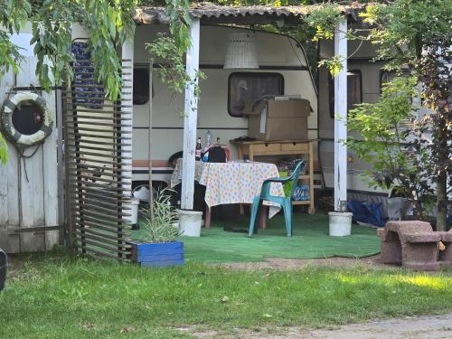 a table and chairs sitting on a patio at Camping - Park Władysławowo in Władysławowo