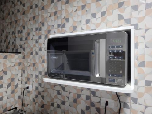 Η κουζίνα ή μικρή κουζίνα στο Apartamento com suíte, localizado na Avenida Silvio Silva, n 33, bairro Hernani Sa, Ilhéus - Ba, sem garagem