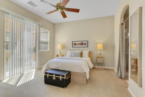 a bedroom with a bed and a ceiling fan at Golfing & Festival Lover's Paradise in Desert Groves Mobile Home Park