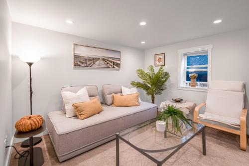 a living room with a couch and a chair at Prestigious 2 Bedrooms 2 Baths in West Point Grey in Vancouver