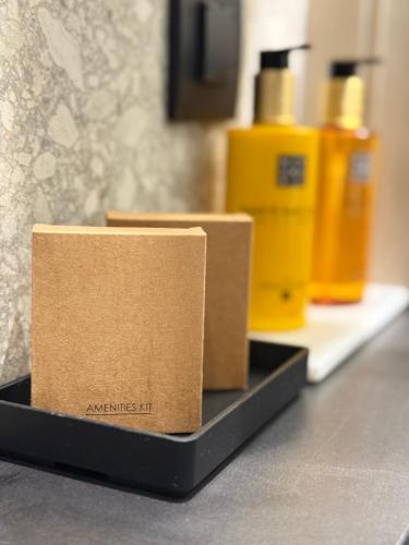 a couple of boxes sitting on a black shelf at Space Row Exclusive Residences in Heraklio Town