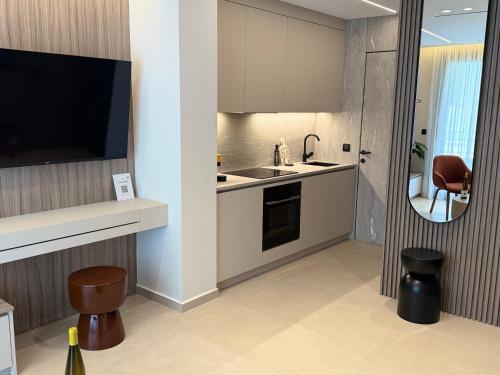 a kitchen with a sink and a counter top at Space Row Exclusive Residences in Heraklio Town