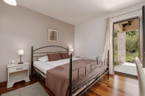 Ένα ή περισσότερα κρεβάτια σε δωμάτιο στο Villa La Vigna Blu