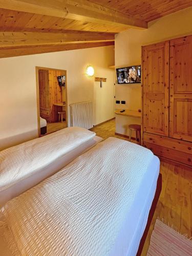 Postel nebo postele na pokoji v ubytování Garni Francescato