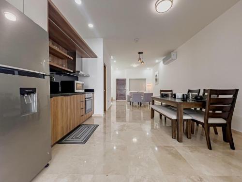 a kitchen and dining room with a table and chairs at Casa Delfines, 2Br home in quiet neighborhood 10 min from downtown in La Paz