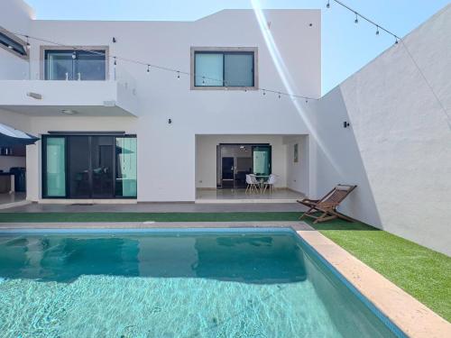 an external view of a house with a swimming pool at Casa Delfines, 2Br home in quiet neighborhood 10 min from downtown in La Paz