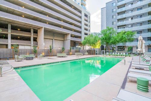 a swimming pool in the middle of a building at Lovely 1BD - Central Downtown - Gym, Pool, Parking in Phoenix