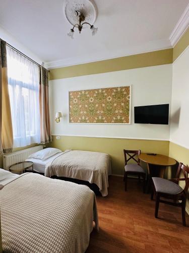 Ένα ή περισσότερα κρεβάτια σε δωμάτιο στο Willa Pałacyk